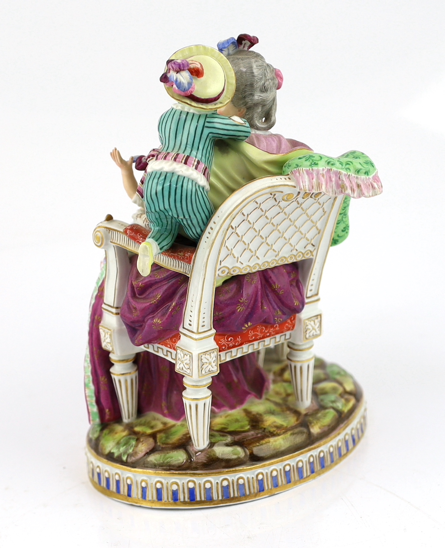 A Meissen group The Good Mother, 19th century, arm detached but present
